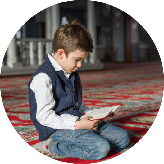 child reading from the Quran